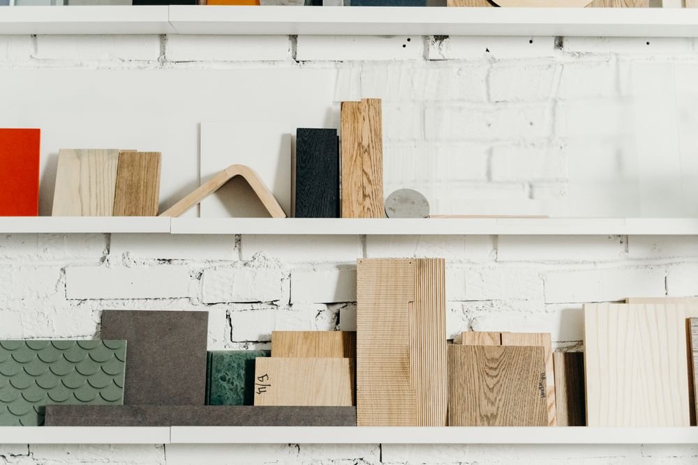 Prefinished decorative panel and wood veneer samples on display shelves