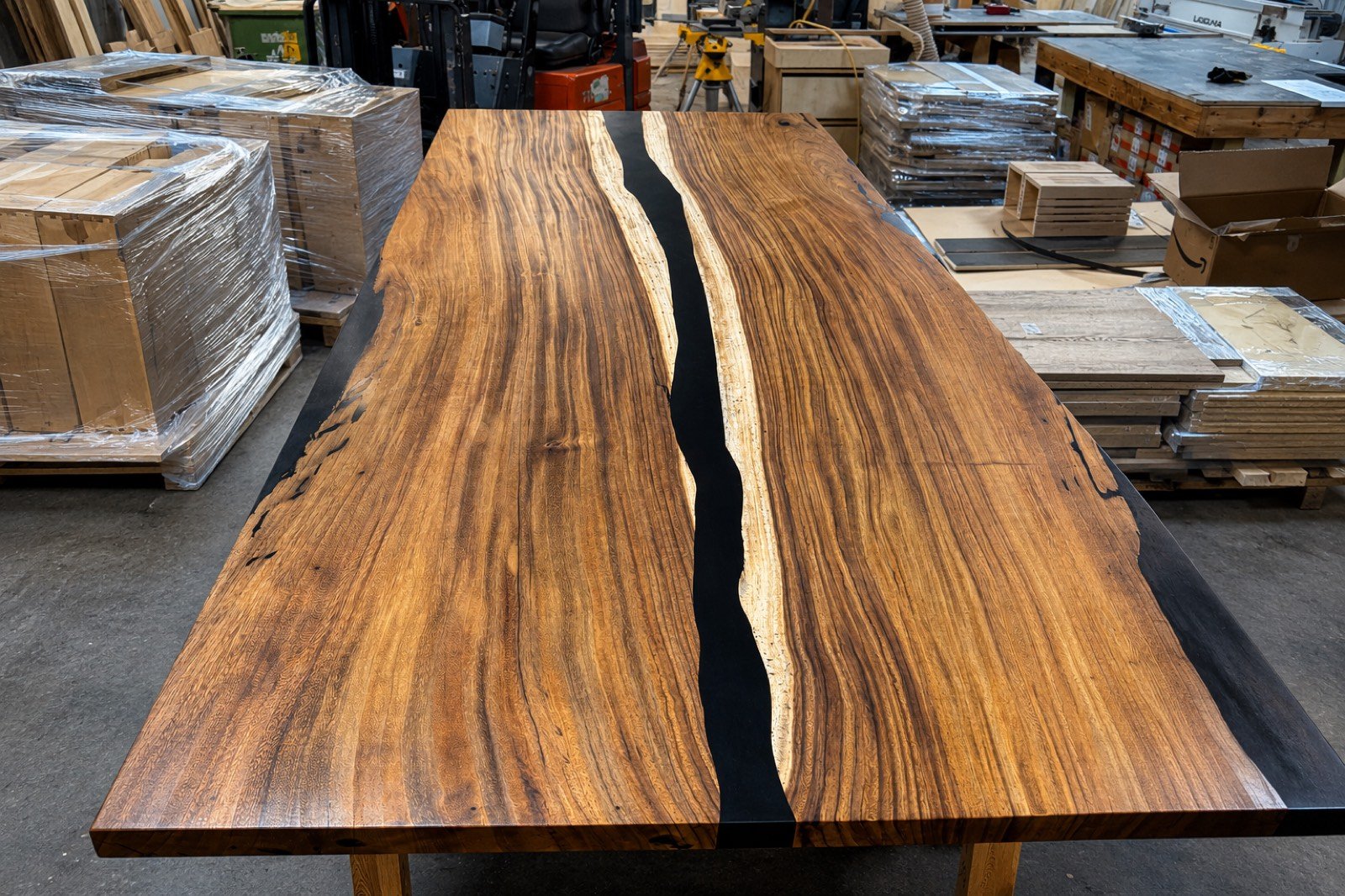 Live-edge wood slab table in the Coastal Precision CNC shop