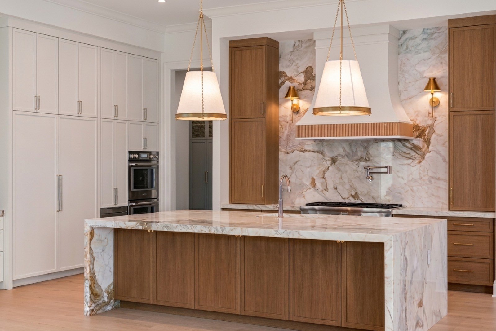 White oak kitchen island with statement pendant lights by Coastal Precision CNC