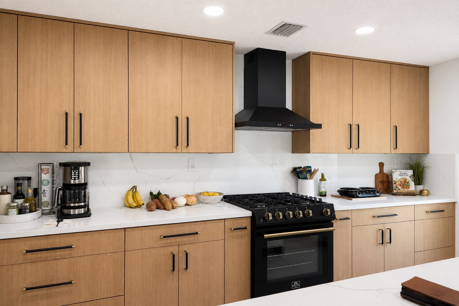 Wood kitchen cabinets with professional range by Coastal Precision CNC